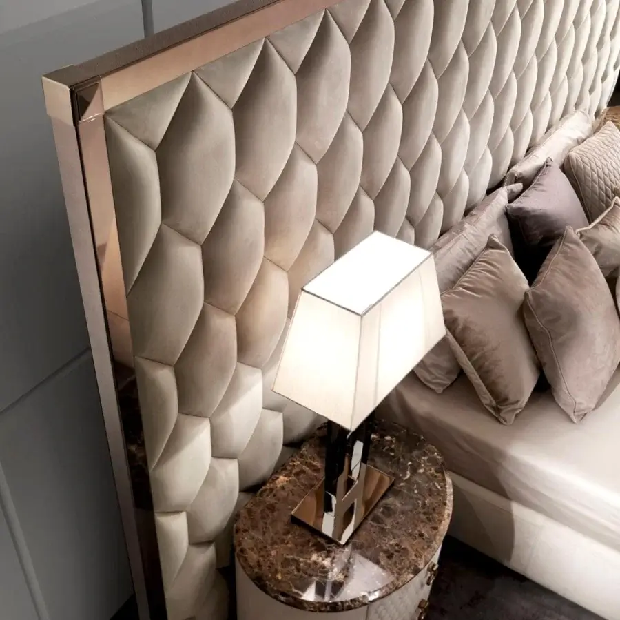 Distinguished DV Home Collection Envy bed crafted in Italy with light beige textile upholstery and polished steel hexagon quilting