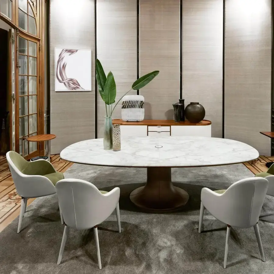 Exceptional Giorgetti Mizar table with an asymmetric marble top and cast bronze base crafted in Italy