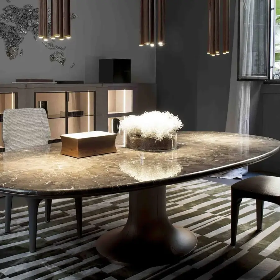 Distinguished Giorgetti Mizar table with a luxurious oval marble top and striking cast bronze base exhibiting a smooth glossy finish