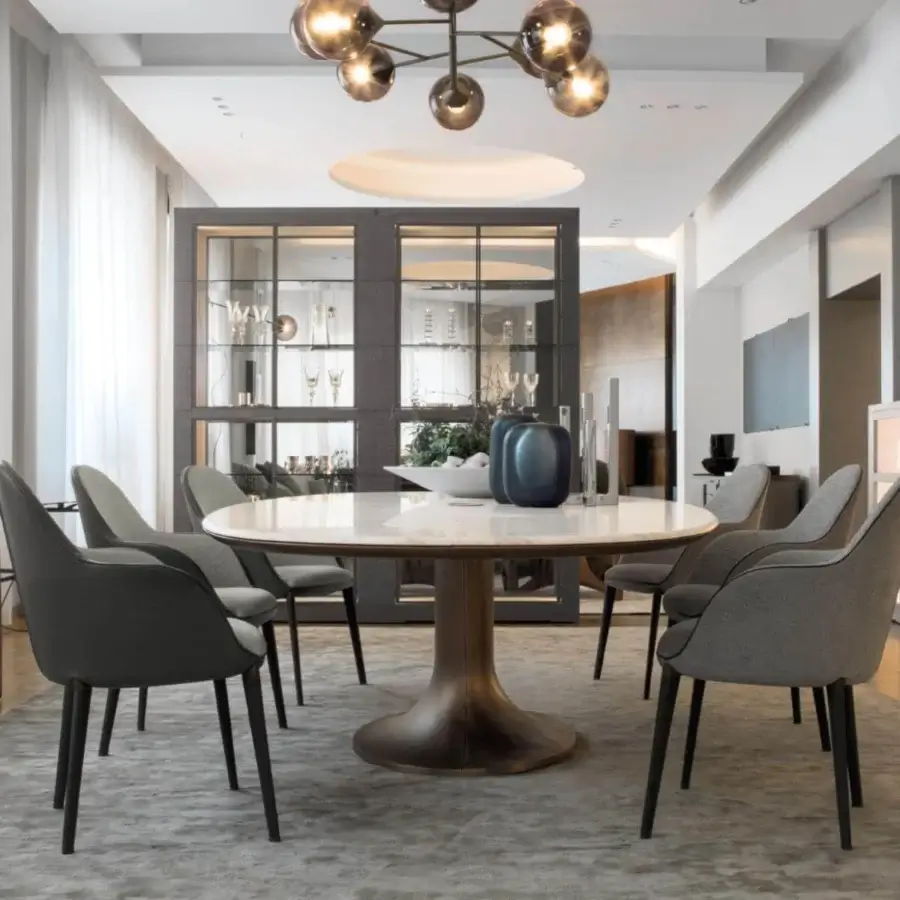 Superior Giorgetti Mizar table with a remarkable round marble top and cast bronze base showcasing asymmetric light tones