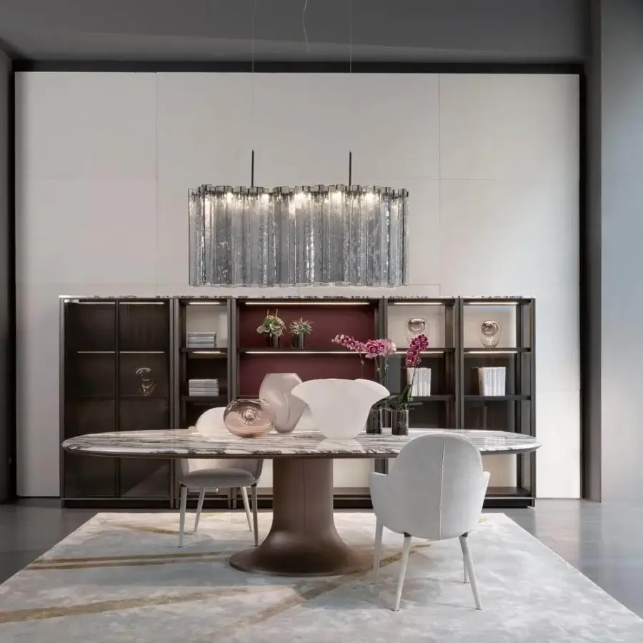 Elegant Giorgetti Mizar table with a lavish oval marble top and cast bronze base featuring natural edges