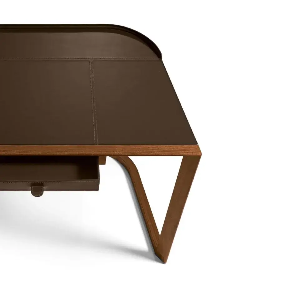 Distinguished Giorgetti Ion desk with Canaletto walnut structure and saddle leather top exhibiting stitched detailing