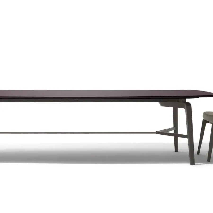 Exceptional Giorgetti Blade table crafted in wood with polished, striped finish shaded in deep burgundy hues