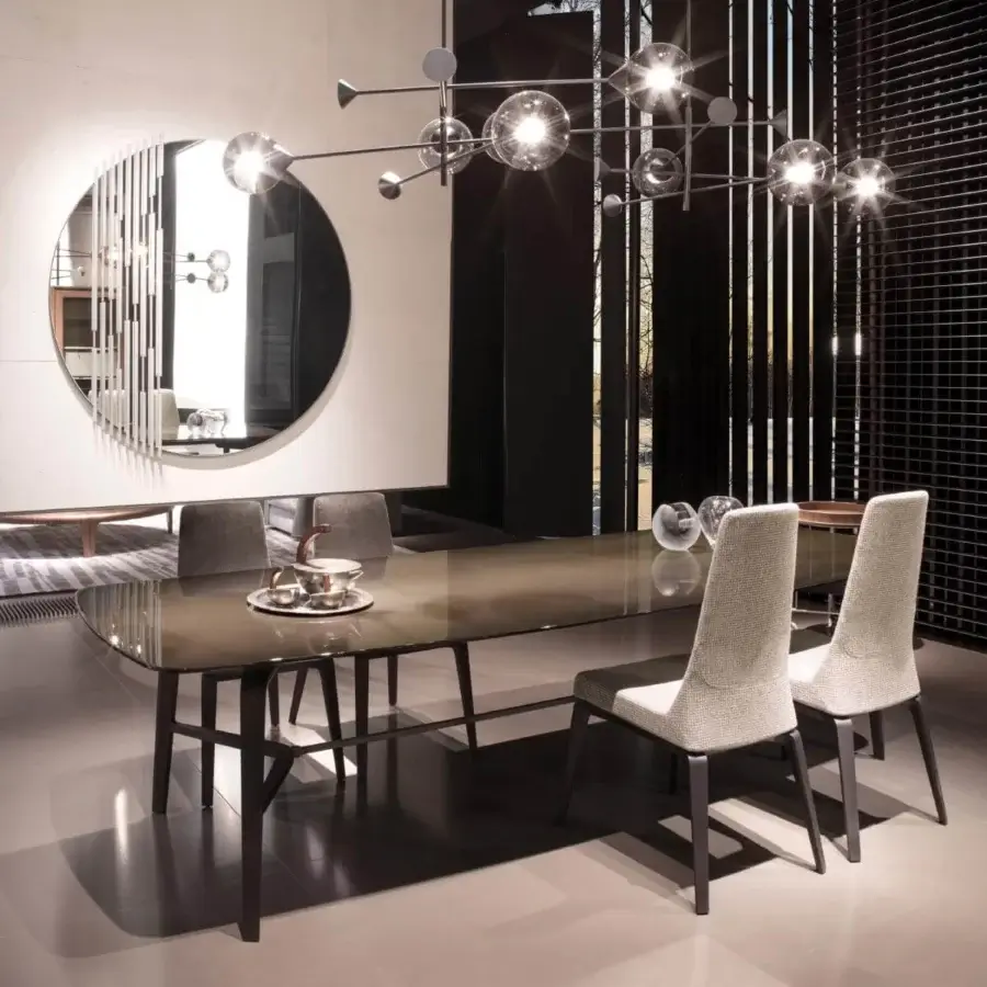 Exclusive Giorgetti Rift mirror with round reflective surface and solid ash wood frame accented with bronze painted metal dividers