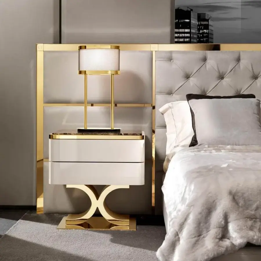 Exclusive DV Home Collection Chelsea bed with light gray quilted fabric upholstery and gold-toned metal detailing