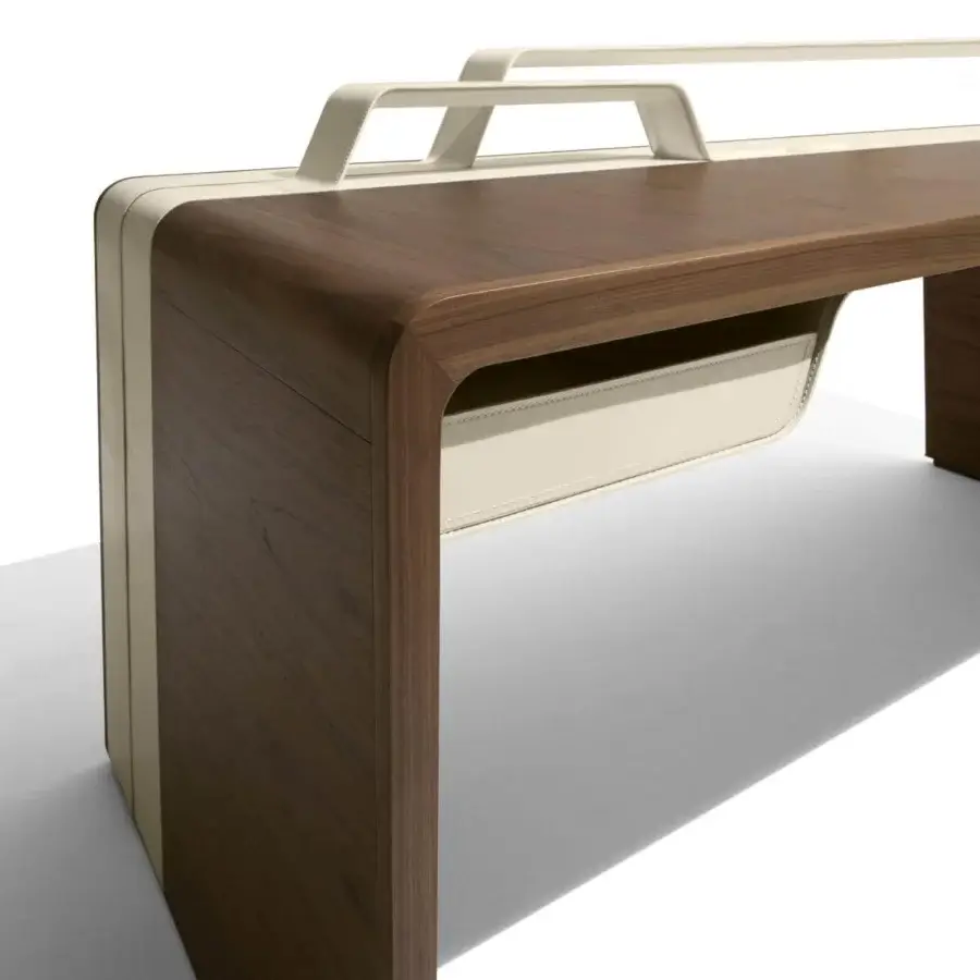 Exceptional Giorgetti Alma desk crafted in Canaletto walnut with saddle leather and clean, curved lines