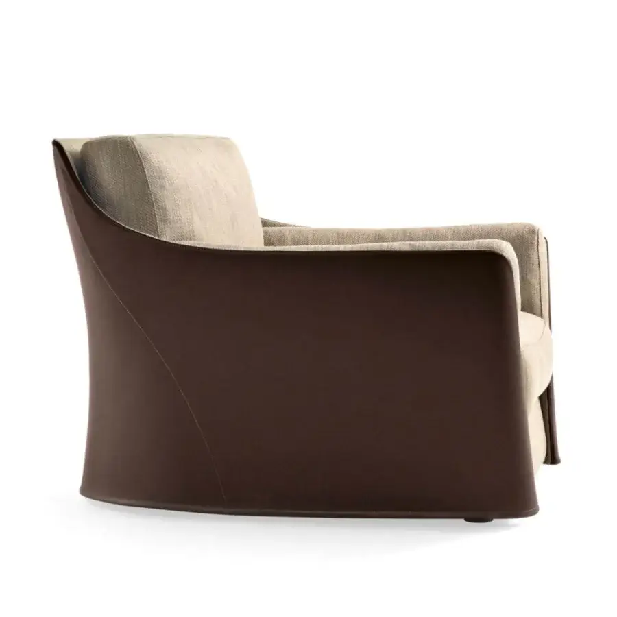 Elegant Giorgetti Vittoria lounge chair with light beige textile cushions and dark brown leather outer shell