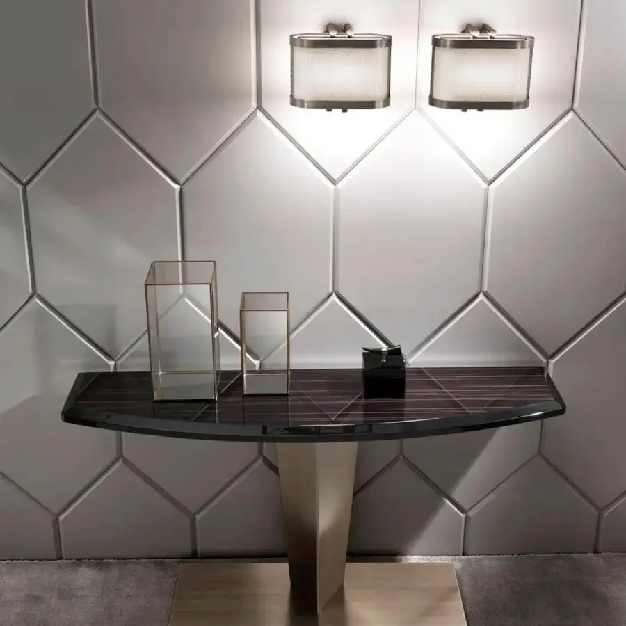 Distinguished DV Home Collection Stanley console with a glossy lacquered dark brown wood top and muted gold satin geometric stainless steel base