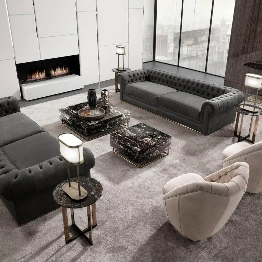 Elegant DV Home Collection Stanley console with a dark top and light-toned stainless steel base embodies sophistication