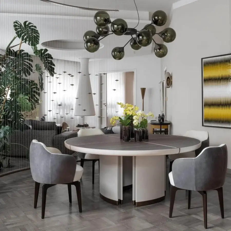 Distinguished Giorgetti Gordon table crafted in maple with dark brown sections and a saddle leather base with bronze painted details