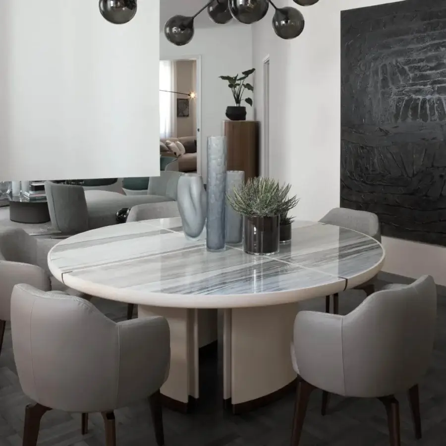 Exclusive Giorgetti Gordon table with light gray and blue-gray striations in a maple and bronze painted structure, plus cream saddle leather base