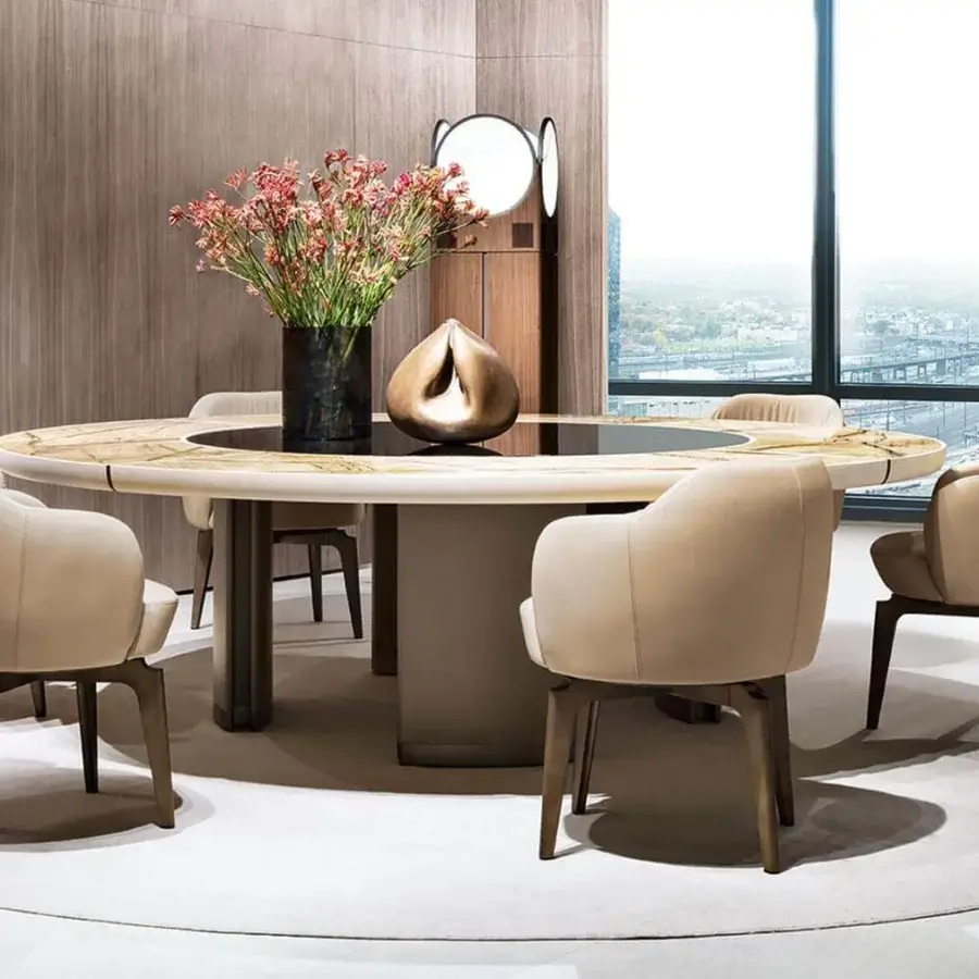 Exceptional Giorgetti Gordon table with wood inserts, saddle leather detailing and refined marble top in bronze painted finish