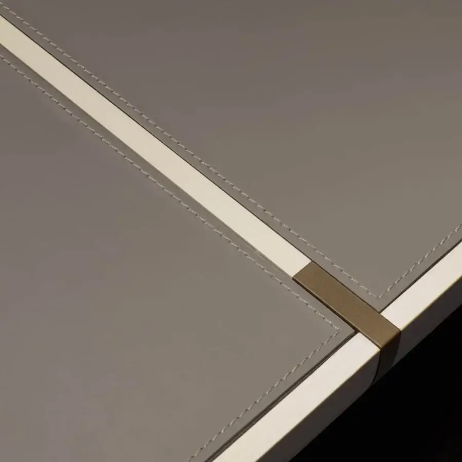 Distinguished Giorgetti Gordon table with saddle leather inserts and bronze painted details in matte gray and cream finish