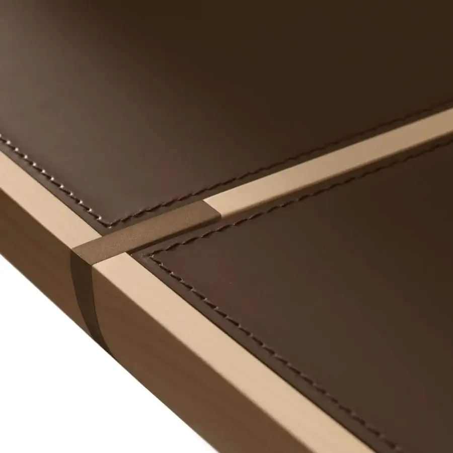 Exclusive Giorgetti Gordon table with shaped saddle leather top and light maple frame with bronze painted details