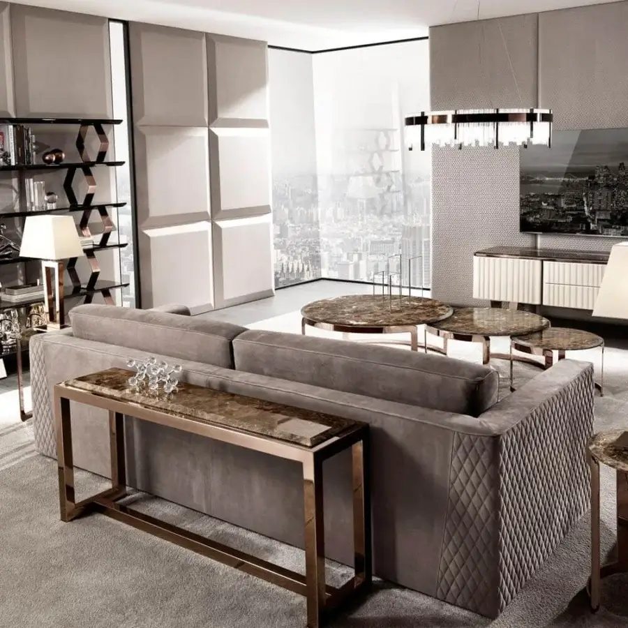 Elegant DV Home Collection Age sofa back console with rose-gold-toned stainless steel base and brown stone-grain tabletop