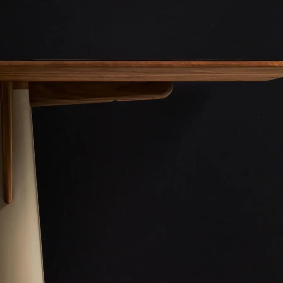 Superior Giorgetti Fang table with a Canaletto walnut top and light beige leather leg, exhibiting a striking contrast of textures