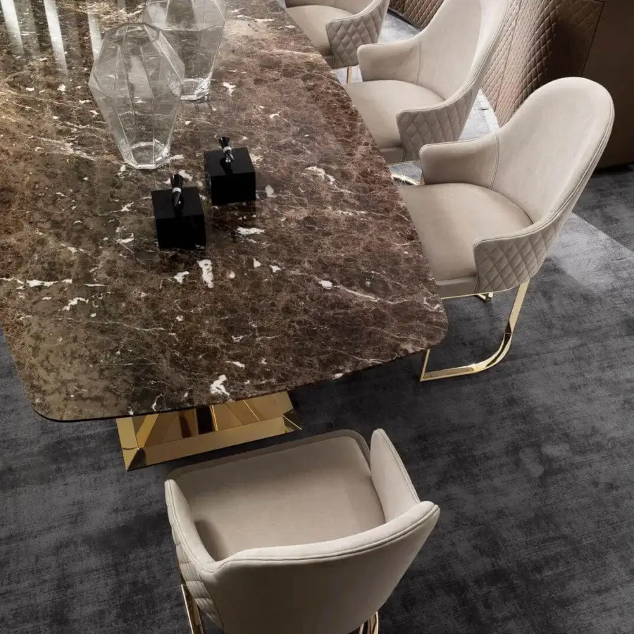 Exceptional DV Home Collection Deco table with a glossy brown marble-like top and geometric gold-toned stainless steel base