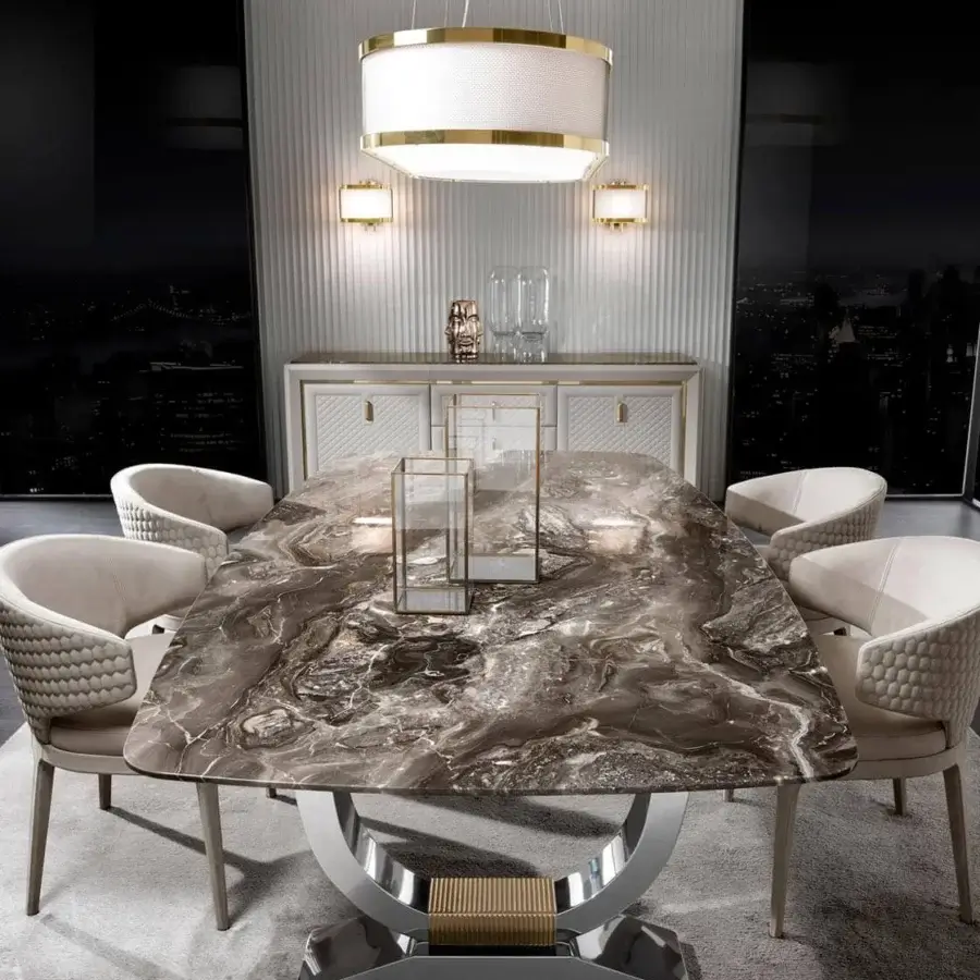 Elegant DV Home Collection Hermes table crafted with stainless steel and a faux marble-like top in swirling browns, grays, and whites with a glossy finish