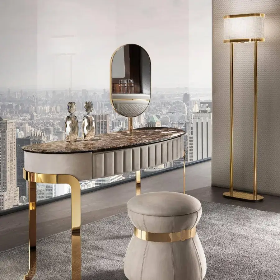 Distinguished DV Home Collection Coco vanity with quilted light beige leather and glossy gold-toned steel legs built with a marble-patterned stone top