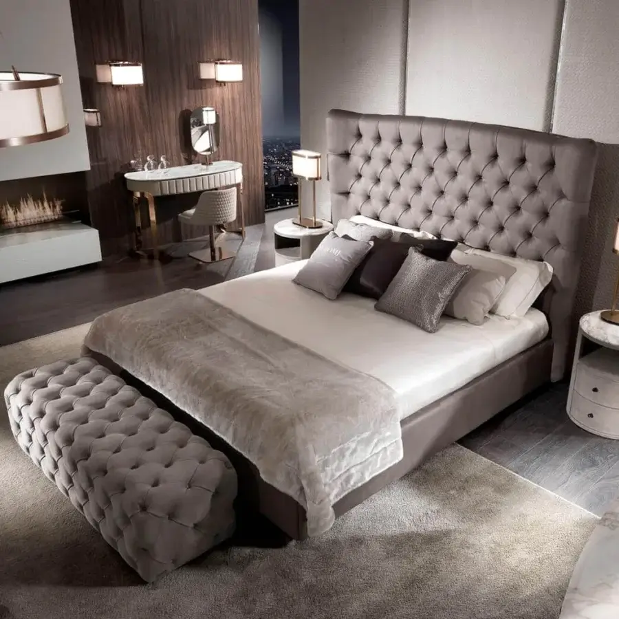 Elegant DV Home Collection Coco vanity with light leather, quilted front, gold steel legs and matte lacquered wood top
