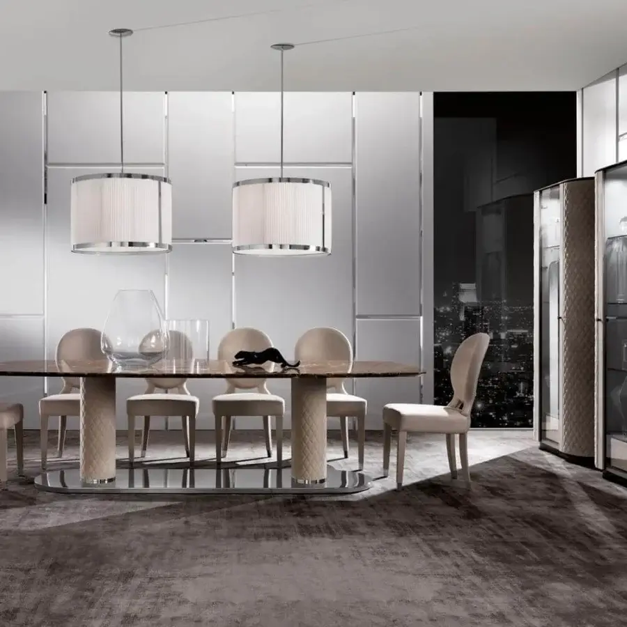 Distinguished DV Home Collection Adler table with oval marble top and quilted beige leather columns, built with a glossy stainless steel base