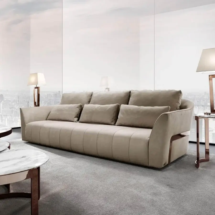 Exclusive DV Home Collection Deco sofa upholstered in smooth matte beige textile with rose gold steel accents and refined stitching