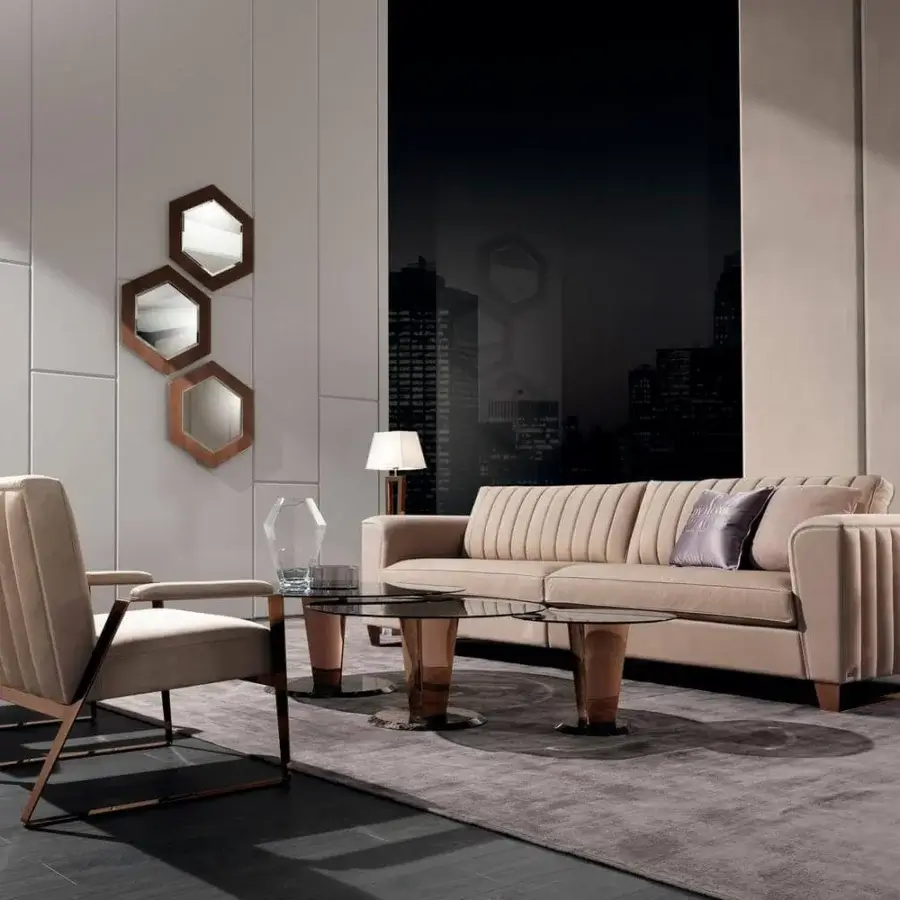 Elegant DV Home Collection Deco lounge chair with light tan textile upholstery and angular copper-toned metal frame