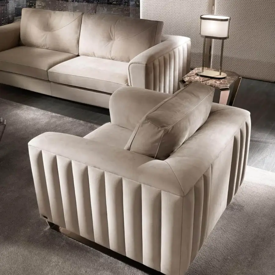 Sophisticated DV Home Collection Beverly lounge chair with uniform beige upholstery and quilted detailing built with solid wood