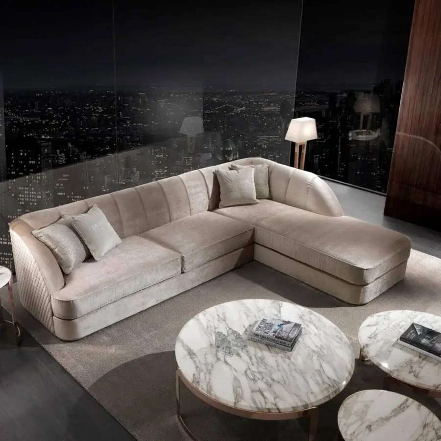 Lavish DV Home Collection Charlotte sectional in light beige plush textile with quilted exterior and goose feather cushions