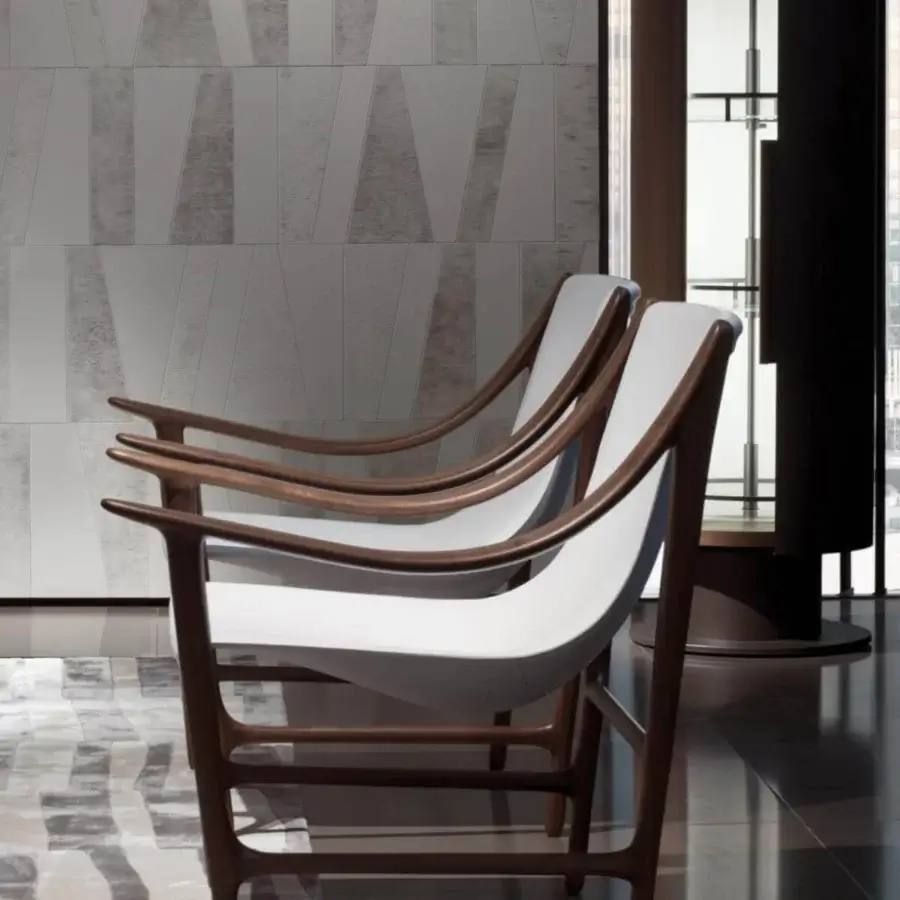 Distinguished Giorgetti Ino bar cabinet with cylindrical silhouette crafted in Canaletto walnut and white Fiddleback Sycamore with bronze accents