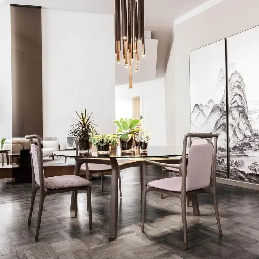 Elegant Giorgetti Ino bar cabinet with curved lines crafted in Canaletto walnut and white Fiddleback Sycamore with a bronze metal base