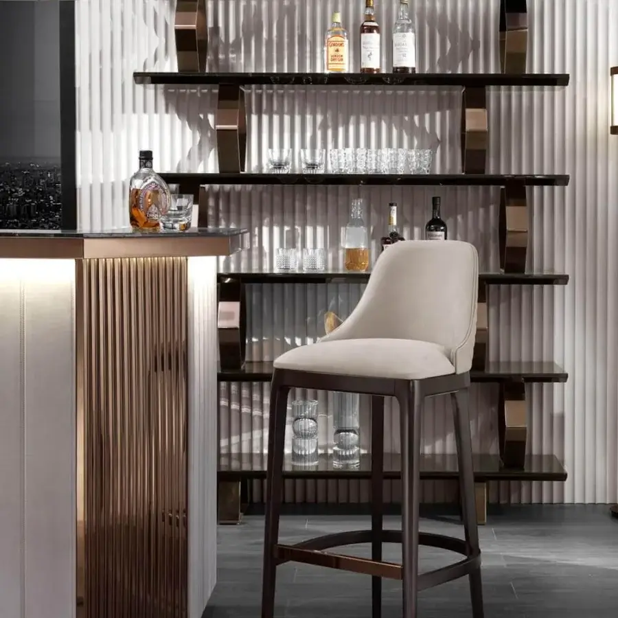 Exclusive DV Home Collection Charlotte bar with light beige leather, Emperador Dark marble, and shaded glossy stainless steel accents