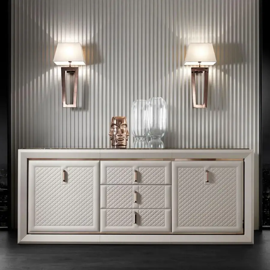 Exceptional DV Home Collection Adler sideboard with light cream leather, stainless steel accents and a dark stone-like top