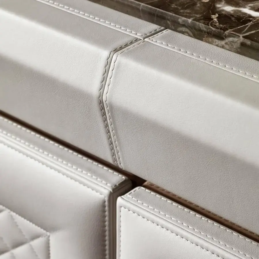 Distinguished DV Home Collection Adler sideboard with off-white leather, stainless steel, dark brown marble and refined quilting