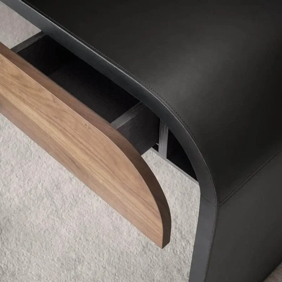 Distinguished 4 Mariani Nami desk crafted with curved black saddle leather and a veneered wood drawer with wireless charging built in