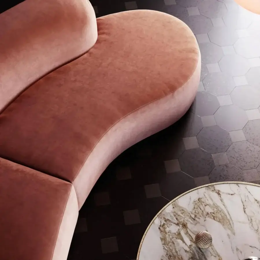 Distinguished Vismara Bolla sofa with enveloping seat, sinuous design and refined steel band base upholstered in muted rose textile