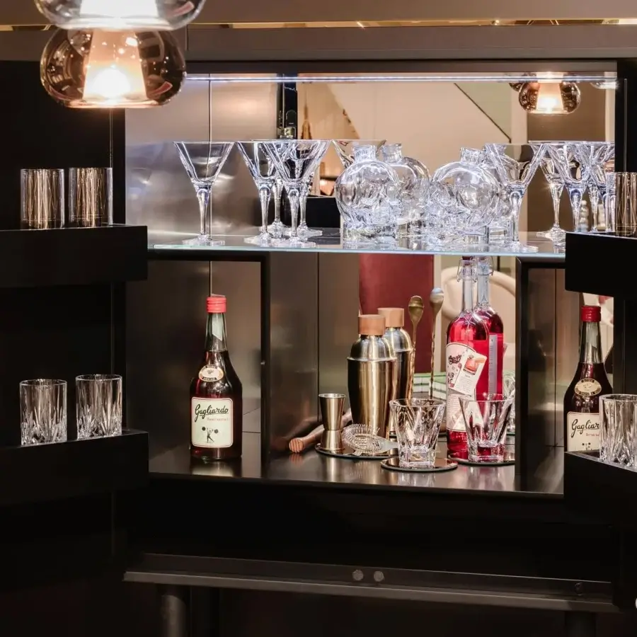 Exceptional Vismara Spirit bar cabinet with slender metal legs, lacquered fiberboard, and Ebony Makassar with maple wood inlay