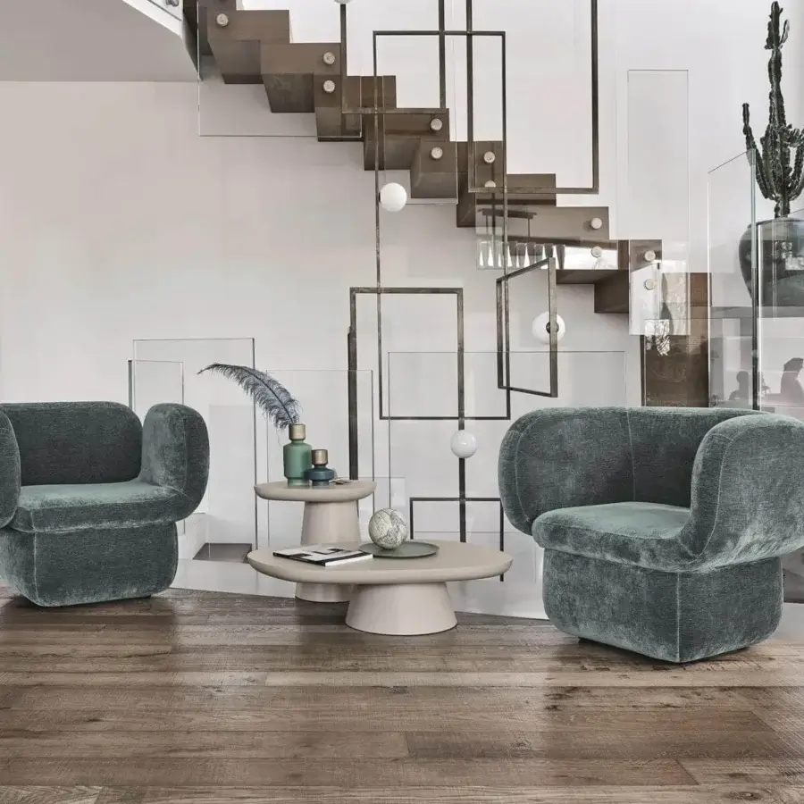 Innovative Ditre Italia Vento lounge chair with organic curves and muted teal fabric finish