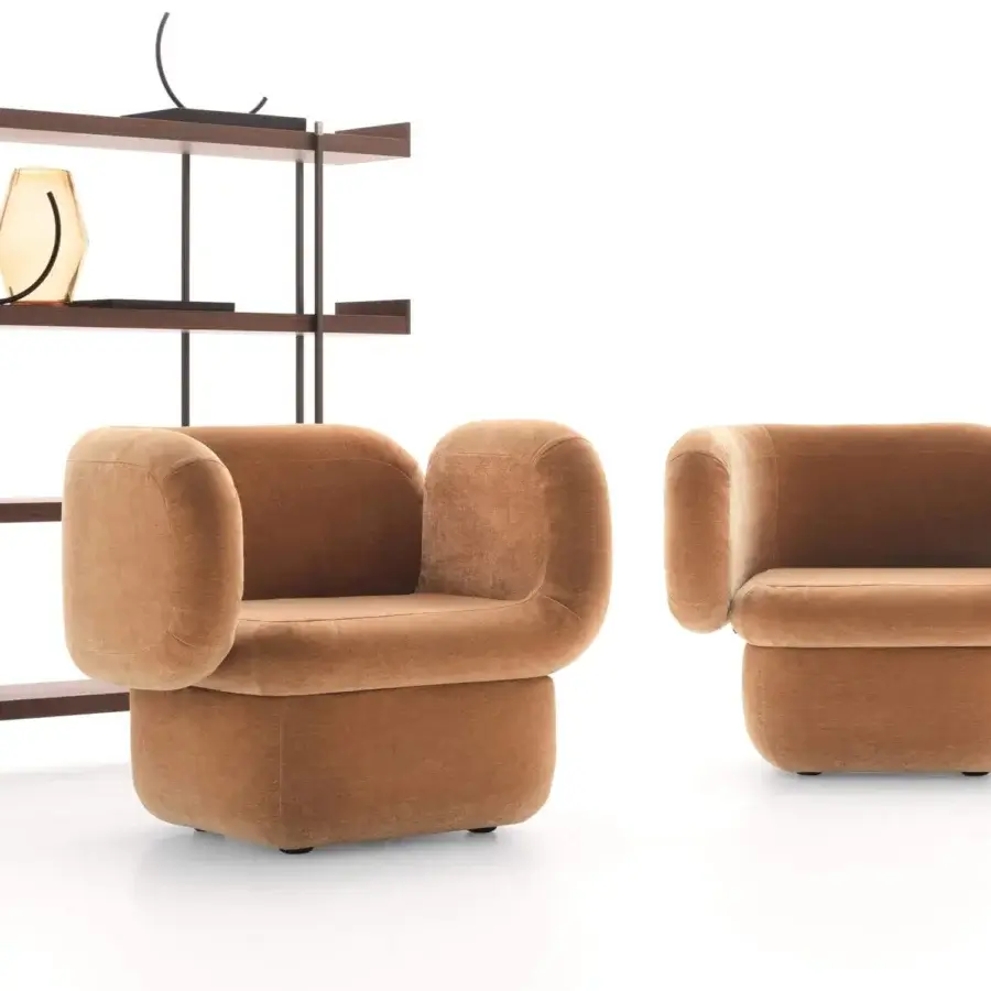 Harmonious Ditre Italia Vento lounge chair with rounded form and warm light brown textile upholstery offering a plush matte finish