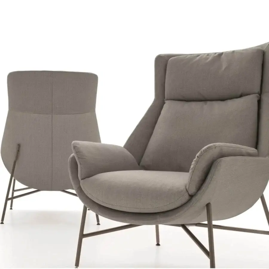 Elegant Ditre Italia Beetle lounge chair upholstered in light gray textile with dark metal legs