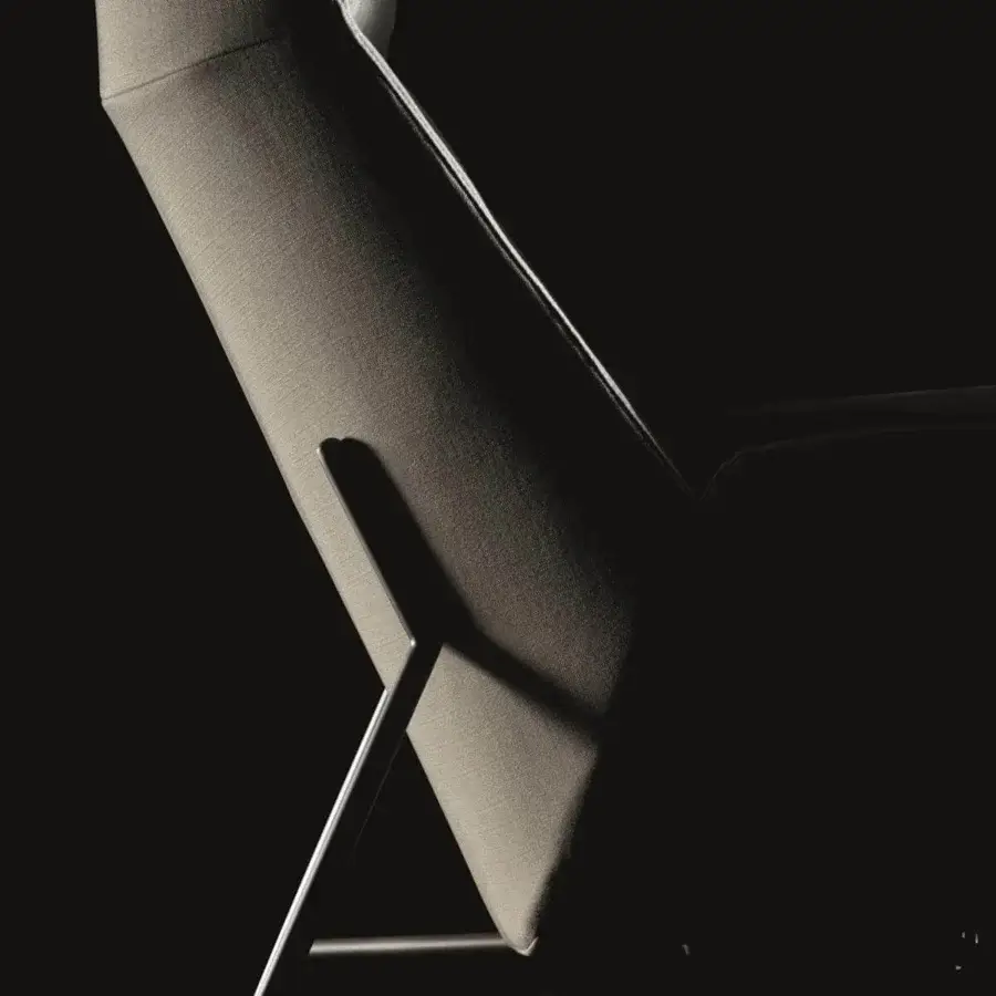 Exclusive Ditre Italia Beetle lounge chair with angled back and smooth neutral textile upholstery crafted with slender metal legs
