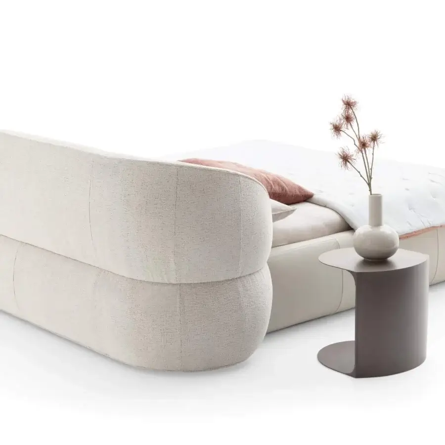 Distinguished Ditre Italia Clip bed with curved headboard and padded base upholstered in textured light cream synthetic material