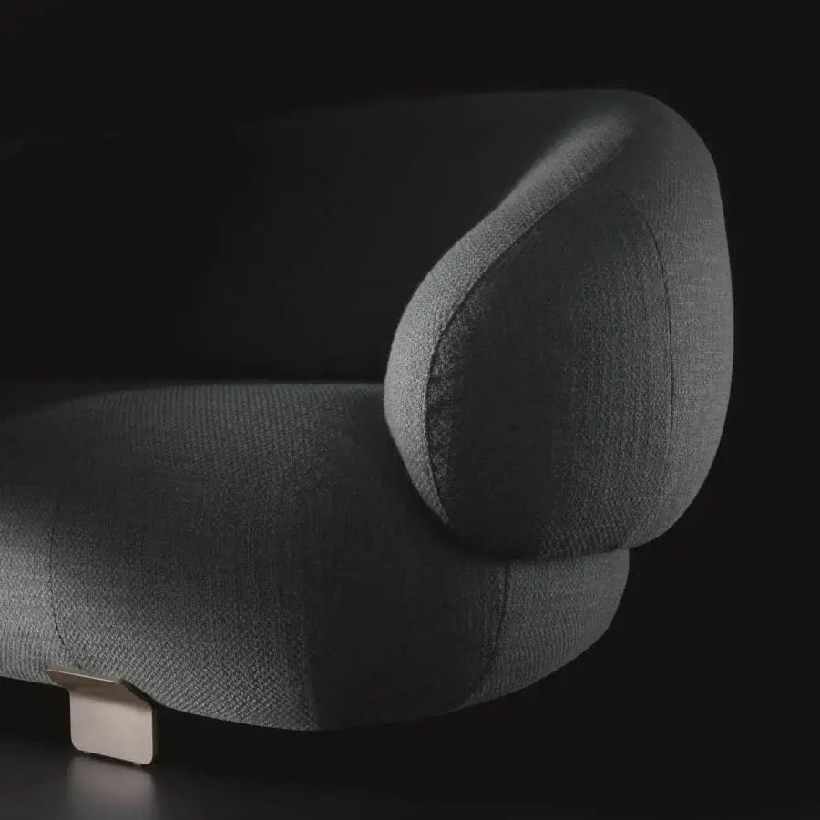 Superior Ditre Italia Pacific sofa presents organic forms upholstered in textured dark green fabric with satin metal support leg
