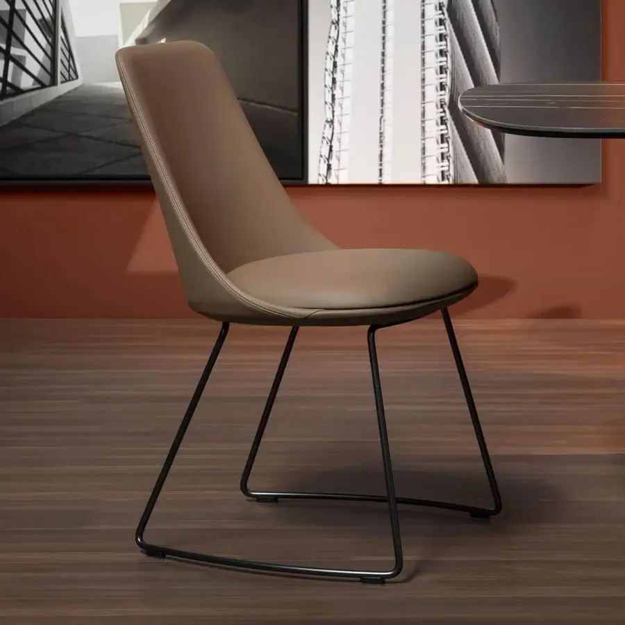 Superior Bonaldo Itala chair with curved backrest upholstered in matte taupe material and sleek black metal frame