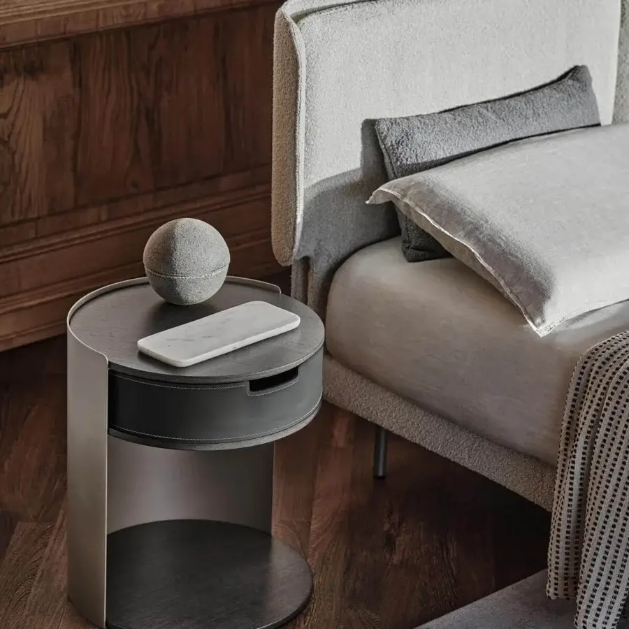 Distinguished Ditre Italia Skin nightstand with bent sheet metal support and veneered wood top covered in stylish bonded leather