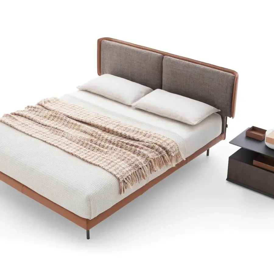 Elegant Ditre Italia Skin bed with light brown leather and greyish-brown fabric cushions, exhibiting a smooth finish