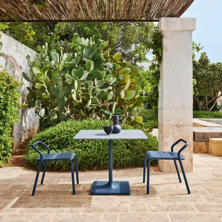 Refined Varaschin Noss chair with aluminum tube structure and dark blue matte powder-coated aluminum seat