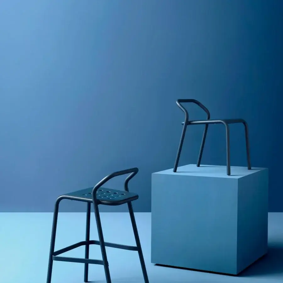 Distinguished Varaschin Noss chair crafted with dark blue powder coated aluminum and curved perforated seat