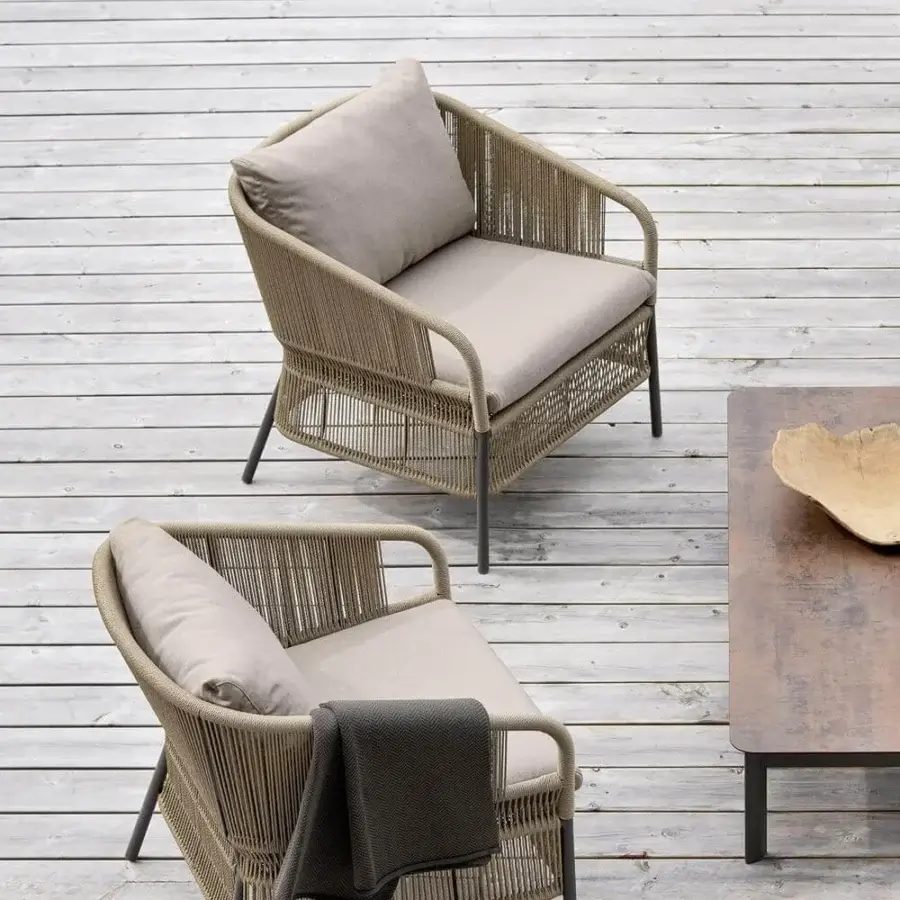 Distinguished Varaschin Cricket lounge chair with hand-woven rope backrest and durable powder-coated aluminum frame in neutral beige textiles