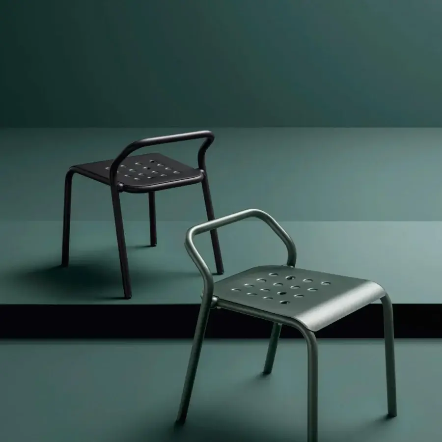 Refined Varaschin Noss chair with powder coated aluminum in a muted green tone and geometric perforated seat